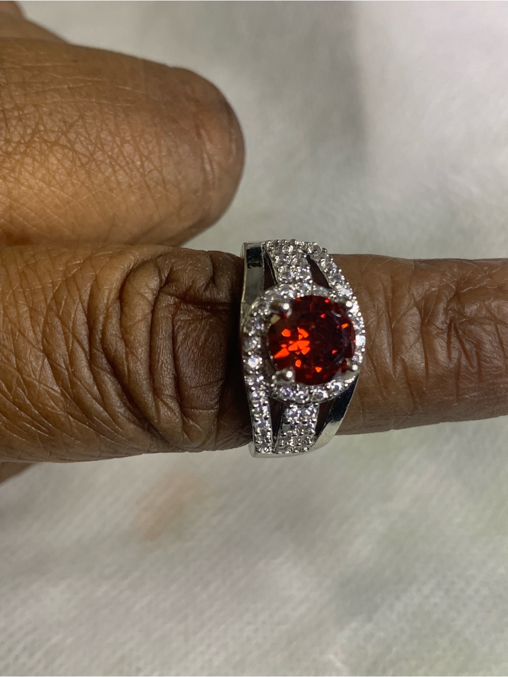 Silver Ring with Deep Red Center Stone and Pavé Accents